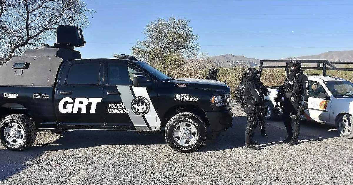 Patrulla y agentes del Grupo Reacción Torreón.