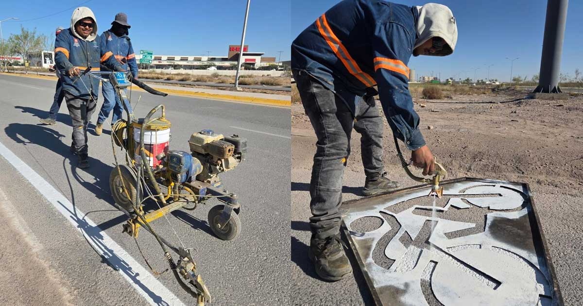 Trabajadores pintando la ciclovía en Torreón.